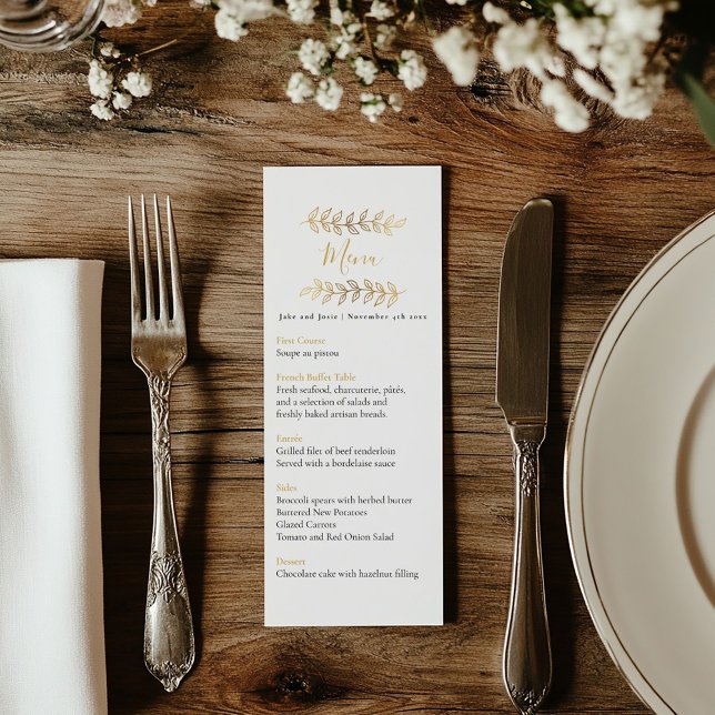 Joli effet or feuille mariage menu table (Wedding reception dinner menu with black and gold text and delicate gold leaves framing the top.)