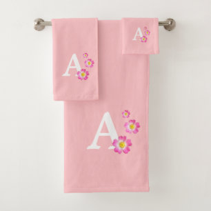 Joli monogramme avec fleurs sur fond rose clair