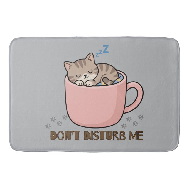 Joli petit chat endormi dans un tapis de bain en f (Devant)