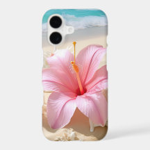 JOLIE FLEUR D'HIBISCUS ROSE SUR PLAGE DE SABLE