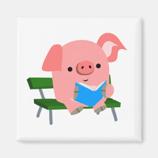 Jolie lecture de cochon de dessin sur un aimant de