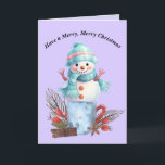 Joyeuse carte Snowman de Noël<br><div class="desc">Joyeuse carte Snowman de Noël. Le Snowman est assis sur une tasse avec des décorations de Noël,  et la carte est principalement bleu et violet clair. Les mots à l'intérieur peuvent être changés. Merci à Creative Fabrica pour certains des éléments du design.</div>