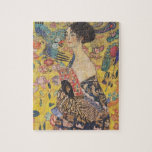 La Dame Gustav Klimt Avec Un Puzzle De Fan<br><div class="desc">Gustav Klimt Lady Au Puzzle Fan. Peinture à l'huile sur toile de 1918. Voici un beau portrait tardif de Gustav Klimt montrant son intérêt pour le Japon. Un grand cadeau pour les amateurs d'art nouveau,  Gustav Klimt,  et de peinture symbolique colorée.</div>