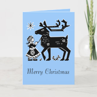 La fille de la Laponie tient la carte de Noël de