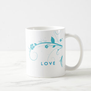 La fleur bleue tourbillonne tasse de café