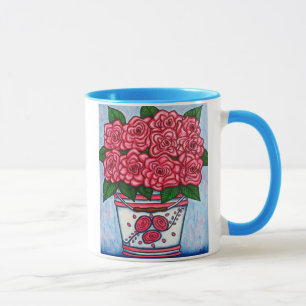 La La luttent la tasse de café rose d'en