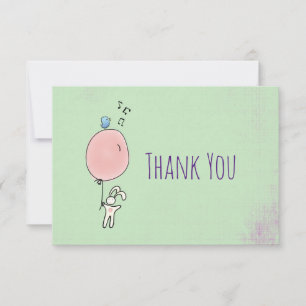 Lapin flottant tenant un Merci à ballon