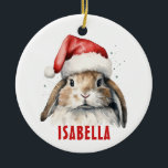 Lapin Lapin Ornement Personnalisé<br><div class="desc">Ajoutez un peu de joie lapin à votre arbre de vacances avec ce ornement de lapin de Noël personnalisé! Doté d'un lapin d'aquarelle moelleux portant un chapeau de Père Noël rouge et le nom de votre enfant en rouge gras, cet ornement en céramique fait un réconfort pour les amoureux des...</div>