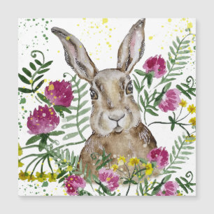 Lapin mignon dans des fleurs à l'aquarelle