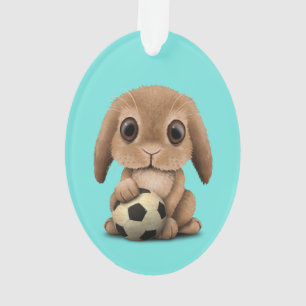 Lapin mignon de bébé avec du ballon de football 
