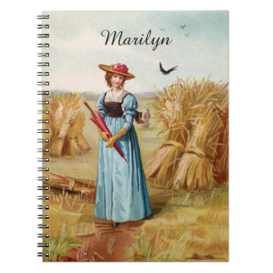 Le cahier de la femme dans le champ de blé
