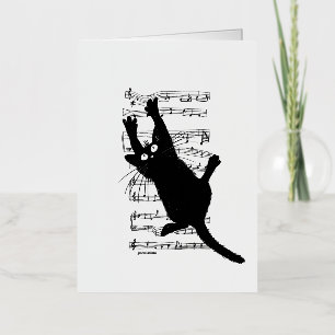 Le chat est accroché à des notes musicales