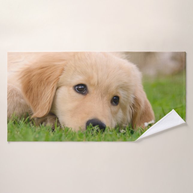 Le chiot mignon de golden retriever rêve la photo (Serviette de bain)