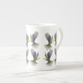 Le Cockatiel de vol Parrots la tasse de porcelaine
