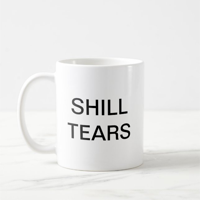 Le compère déchire la tasse avec le manteau de (Gauche)
