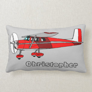Le coussin du garçon mignon, avion rouge avec le