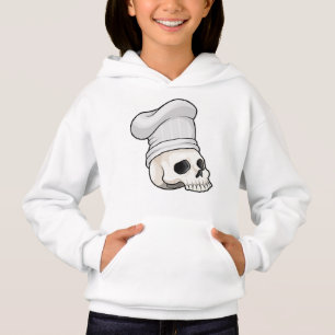 Le crâne cuisiné avec le casquette chef