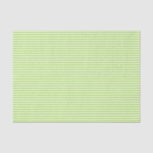 Le filet de vert de chaux barre le papier de soie