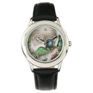 Le koala mâchant une feuille badine la montre