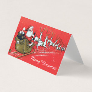 Le Père Noël Vintage sur sa sellette avec le renne