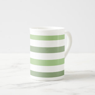 Le vert barre la tasse horizontale de porcelaine
