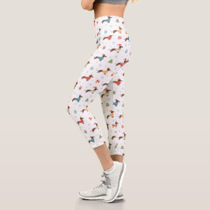 Leggings Capri Dachshunds dans le Motif des pulls de Noël
