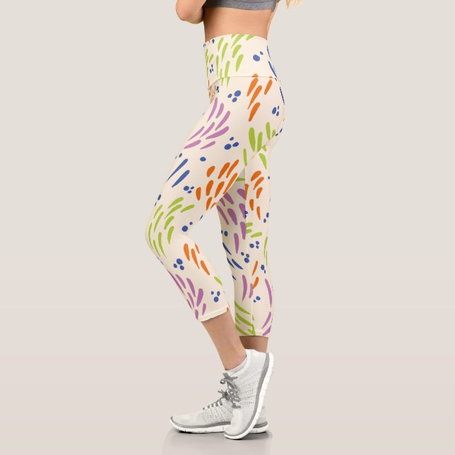 Leggings Capri Flux en bleu, orange, violet, vert et crème (Gauche)