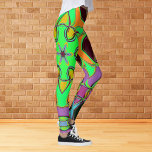 Leggings Dessin Mandala Flower vert orange et violet<br><div class="desc">Cette fleur de mandala funky est décorée de vert,  d'orange et de violet dans un style de dessin animé. Des visuels géométriques trippy pour l'hippie moderne ou amoureux de couleurs vibrantes!</div>