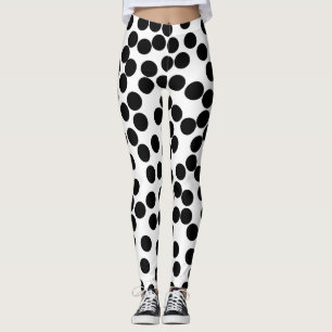 Leggings grand pois aléatoire noir sur les guêtres blanches
