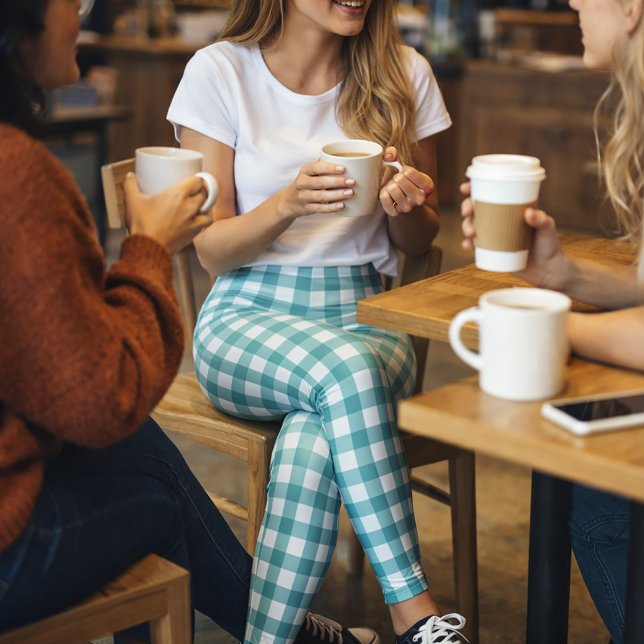 Leggings Motif carreaux gingham sarcelle et blanc (A pair of leggings with a teal and white gingham plaid pattern.)