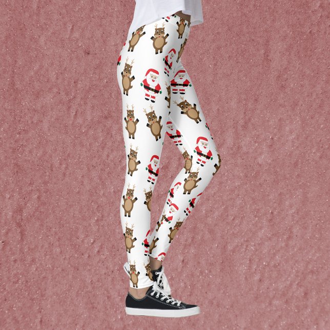 Leggings Santa Claus Red Suit Reindeer Motif de Noël (A pair of leggings featuring a pattern of Santa in a red suit and reindeer.)