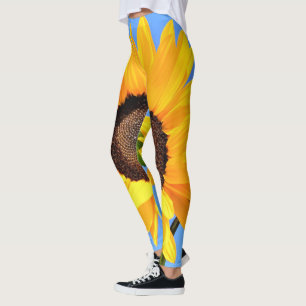 Leggings Tournesol jaune contre le soleil sur le ciel bleu 