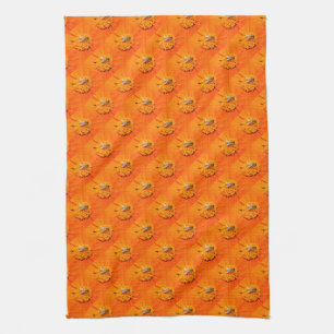 les abeilles sur l'orange fleurit la serviette