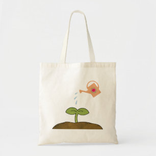 Les arbres d'usine de jour de la terre font un sac