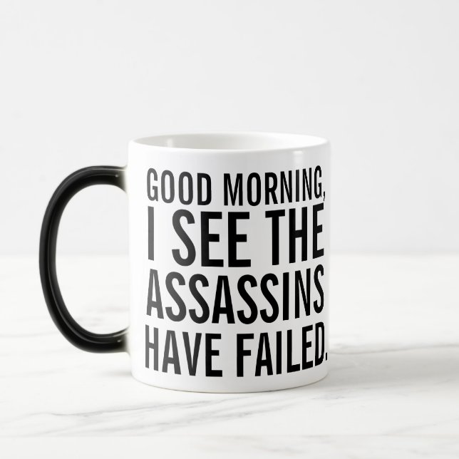 "Les assassins ont échoué" tasse à café (Gauche)