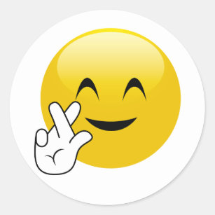 Les doigts ont croisé des autocollants d'Emoji