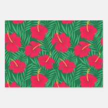 Les fleurs rouges d'Hibiscus sur les Feuilles trop