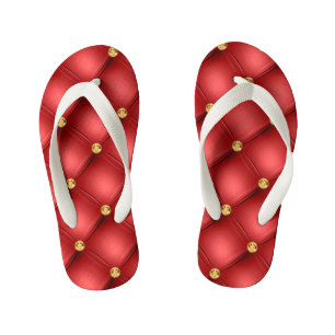 Les tongs de l'enfant rouge et or