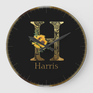Lettre noire et or H Tournesols ronds Horloge