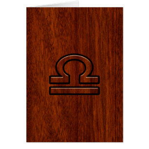 Libra Zodiac Symbol on Mahogany
