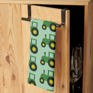 Linge De Cuisine Conception de tracteur vert sur fond de couleur au