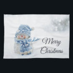 Linge De Cuisine Cute Snowman au photographe de Christmas<br><div class="desc">Une serviette de cuisine avec une jolie photo avec un petit bonhomme de neige. Debout dehors en hiver avec de la neige qui tombe tout autour. Ce mignon petit gars est habillé en vêtements de plein air tricotés bleus. Un peu de bokeh blanc/gris s'enflamme dans l'arrière - plan.</div>
