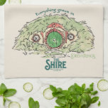 Linge De Cuisine Everything Grows in THE SHIRE™<br><div class="desc">Bring a little piece of Middle-Earth™ to your everyday with this charming Lord of the Rings™ design inspired by the cozy hills of Hobbiton. Featuring a storybook-style hobbit hole with its iconic round green door tucked into a lush hillside, the artwork is paired with the beloved phrase, “Everything grows in...</div>
