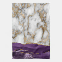 Paillettes dorées brillantes sur marbre blanc viol