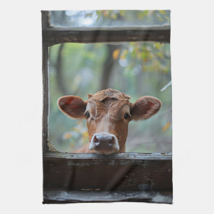 Linge De Cuisine Une vache curieuse qui regarde à travers une fenêt