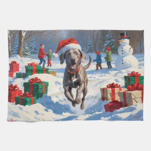 Linge De Cuisine Weimaraner courant dans la neige avec un chapeau d