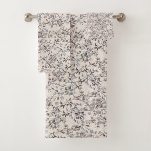 Linge de lit beige et motifs floraux gris
