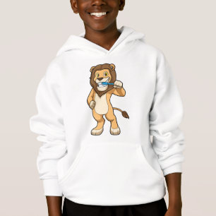 Lion avec brosse à dents