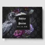 Livre D'or Bouquet floral gothique Moody sur dentelle noire a<br><div class="desc">Ce livre d'hôtes est parfait pour un mariage gothique moderne et élégant. Le design floral moody présente un bouquet naturel de fleurs de violet et de lavande avec un corbeau noir sur un arrière - plan de dentelle violet foncé et noir. Vous pouvez personnaliser avec vos prénoms et votre date...</div>