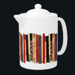 Livre Teapot<br><div class="desc">Cette théière en porcelaine blanche de couleur brillante dispose d'une étagère de livres colorés. Ils forment un motif géométrique abstrait intéressant en couleurs vert,  brun,  jaune,  rouge,  bleu,  noir et rose.</div>